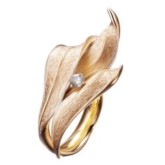 This contemporary Lily of The Valley Engagement Ring is made of 18 karat yellow gold and one round diamond. It has a sculptural shape. We use top colour natural diamonds, VS, 0,18 carats. We work with German gems companies that have been in business since the 19th century. The ring can be personalised with a name or a saying. Please allow us time to customize the ring. The ring can be ordered as usual fashion ring. The size and the colour of the gold can be changed. Neck Pieces Jewelry, Art Nouveau Ring, Chic Rings, Art Jewelry Contemporary, Contemporary Ring, Jewels Rings, Couture Jewelry, Harper's Bazaar, Gold Jewellery Design