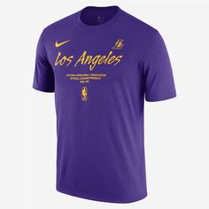 An essential piece of gear for any Los Angeles Lakers fan. Show your love for your squad in this soft, classic-fit Los Angeles Lakers tee. Nike Sports Fan T-shirt With Logo Print, Nike T-shirt With Team Spirit Logo Print, Nike Sports Fan T-shirt For Fan Merchandise, Nike Team Spirit T-shirt With Logo Print, Nike T-shirt For Sports Fans, Nike T-shirt For Fan Gear With Logo Print, Nike Team Spirit Moisture-wicking T-shirt, Nike T-shirt With Logo Print For Fan Gear, Nike T-shirt With Logo Print For Fans