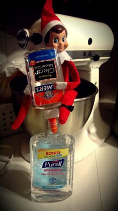 an elf is holding a bottle of mouthwash