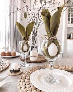 the table is set with dishes and place settings