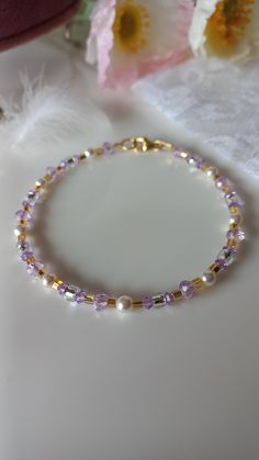 Sparkling bracelet with river micropearls, gold Toho pearls and lilac Swarovski. Adjustable! Extremely long-lasting, hypoallergenic 24k gold-plated components. Perfect to combine with a lilac dress for a special event! Would you like to have the necklace and earrings too? Send me a message! He knows Elegant Purple Crystal Bracelet With Spacer Beads, Elegant Lavender Beaded Bracelets, Elegant Beaded Lavender Bracelets, Elegant Lavender Beaded Bracelet, Elegant Lavender Crystal Bracelet With Round Beads, Elegant Hypoallergenic Purple Beaded Bracelets, Elegant Purple Jewelry With Gold Beads, Gold Pearl Crystal Bracelet With Round Beads, Delicate Gold Beaded Crystal Bracelet