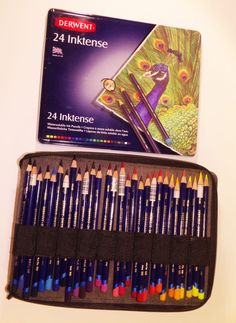 the box contains 24 colored pencils and an open case with it's contents