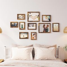 a bedroom with white walls and pictures on the wall above the bed, along with two nightstands