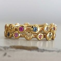 Eternity Gold Ring, Gold Sapphire Ring, Engagement Ring, Eternity Band, Gold Stacking band, Sapphire Engagement Ring, Anniversary Ring. Original and unique gold band with multi color sapphires set all around. Delicate and very classic, fine piece of jewelry. Solid 14 karat Gold, hand crafted. You can wear it as a single band, or stack it up for extra vibrant colors. Details - * 14 karat solid yellow gold. * Multi color Sapphires, set all around (14 stones all together). * Width - 3.5 mm / 0.4 in Multicolor Multi-stone Stackable Rings In Fine Jewelry Style, Multicolor Multi-stone Stackable Fine Jewelry Rings, Multicolor Stackable Sapphire Ring Fine Jewelry, Multicolor Stackable Round Band Rings For Anniversary, Multicolor Stackable Rings For Anniversary, Multicolor Stackable Birthstone Ring, Gold Eternity Band With Birthstone, Multicolor Gemstone Stackable Rings, Gold Multi-stone Sapphire Promise Ring