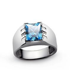 Metal: Sterling Silver Purity: 925 (hallmarked)Gemstone ctw: 3.40Cut: Rectangular FacetedSize: 0.8x1.0 cm (0.3"x0.4")Setting Type: Semi BezelAccent Stones: DiamondsCarat Total Weight: 0.04Setting Type: PavéCut/Color/Clarity: Good/H/VS1 ------------------- Show off your unique and bold style. This ring boasts one rich-colored gemstone atop a shank crafted from a glistening sterling silver. Sleek style with a slight sparkle! Mens Gemstone Rings Unique, Gemstone Rings Unique, Mens Gemstone Rings, Sterling Silver Mens Rings, Mens Rings, Rings Unique, Blue Topaz Gemstone, Men Ring, Mens Silver Rings