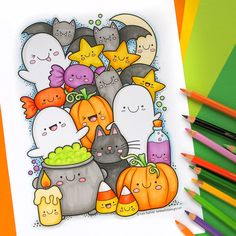 a halloween coloring page with lots of cats and pumpkins in the background, surrounded by colored pencils