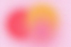 an orange and pink blurry image on a light pink background