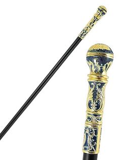 a black and gold colored cane with an ornate design on the top, in front of a white background