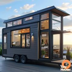 the tiny house is on wheels with windows