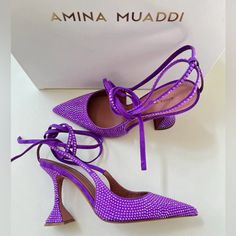 These Purple Amina Muaddi Karma 95 Crystal Suede Pumps Feature A Pointed Toe, Sculpted 95 Mm Heel, All-Over Embellishments, Branded Leather Insole And Slingback Strap With Ankle Tie Detailing. If Our Actions Determine Our Future Fate, We're On Our Best Behaviour. We're After Some Good Karma By Way Of These Amina Muaddi Pumps, Please. This Piece Fits True To Size. We Recommend You Select Your Regular Size. Luxury Purple Heels, Mach Mach Shoes Purple, Amina Muaddi Purple Heels, Hand Embellished Heels For Evening, Hand Embellished Heels For Party, Embellished Purple Heels For Evening, Purple Crystal Embellished Heels For Evening, Purple Crystal Embellished Evening Heels, Chic Embellished Purple Heels