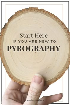 a person holding up a piece of wood with the words start here if you are new to photography