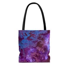 A bag that's soft to the touch and just as lovely on the inside, this magenta marble luxe tote is not your average handbag. The deep red, blue, and purple marble pattern provides a luxurious look that will stand out in any crowd. Hand-sewn with double-stitching in the United States, this bag is made to last. It's an investment piece you won't regret.