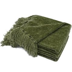 a pile of green towels folded on top of each other with fringes around the edges