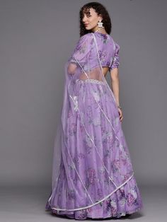 This timeless 3-piece set includes an ankle-length lavender printed lehenga choli, an unstitched sleeveless blouse, and a solid lavender dupatta with a taping border. Perfect for traditional occasions, the lightweight fabric ensures comfort and a stylish flared hem adds flair. Material & Care TOP: Soft Organza, BOTTOM: Soft Organza with Shantun Inner, DUPATTA: Net, Dry Clean Floral Print Sarees, Floral Saree, Net Blouses, Lehenga Blouse, Ethnic Looks, Green Saree, Floral Gown, Organza Fabric, Printed Sarees