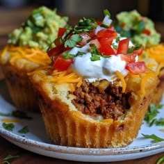 two taco cups on a plate with toppings