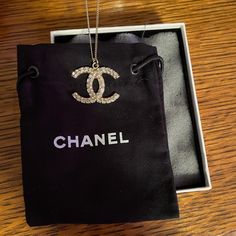 Chanel Logo Necklace. Never Worn. Received As A Gift Years Ago And Never Wore. Stored In Original Box & Dust Bag. Chain Is 18" Long I Believe. Front Has Stones All Along The C's. Very Pretty, Just Wasn't My Style. Luxury Diamond Necklace For Party, Luxury Necklaces With Diamond Accents For Evening, Luxury Evening Necklaces With Diamond Accents, Luxury Diamond Accented Necklaces For Evening, Designer Round Necklace For Formal Occasions, Luxury Necklaces With Diamond Accents For Gift, High-quality Silver Jewelry For Gifts, Luxury Crystal Jewelry With Vs Clarity, Luxury Diamond Accents Necklace For Gift