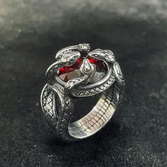 🎁Made from durable stainless steel, this ring features a design of four snakes intricately twisted and wrapped around a central red zircon stone. Fantasy Rings Magic, Fantasy Rings, Man Rings, Ring Magic, Inktober 2024, Fantasy Ring, Serpent Ring, Magic Items, Products Photography