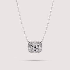 Elevate your style with this exquisite necklace crafted from 14K white gold. The centerpiece features a radiant cut solitaire lab diamond encircled by a dazzling halo of smaller lab diamonds, creating a mesmerizing cluster effect. With its timeless elegance and sophisticated design, this necklace is sure to become a cherished piece in your jewelry collection. ✤𝐃𝐢𝐚𝐦𝐨𝐧𝐝 𝐃𝐞𝐭𝐚𝐢𝐥𝐬 Color: F Clarity: VS1 Shape: Radiant Cut Carat Weight: 1 CT Approx. (5*7 MM) Type: Lab Diamond ✤ 𝐒𝐢𝐝𝐞 𝐃𝐢𝐚𝐦𝐨𝐧𝐝 𝐃𝐞𝐭𝐚𝐢𝐥𝐬 Color: F Clarity: VS1 Shape: Round Carat Weight: 0.12 CT Type: Lab Diamonds ✤Metal 𝐃𝐞𝐭𝐚𝐢𝐥𝐬 Metal Purity: Solid 14K Gold Metal Tone: Yellow, White, Rose Stamp/Hallmark: Yes Jewelry Certificate: Free of Cost with Listed Design Chain Length: 16″ inch Diamond Cluster Necklace, Jewelry Certificate, Cluster Necklace, Necklace Craft, Radiant Cut, Fine Jewellery Necklace, Diamond Cluster, Sophisticated Design, White Rose