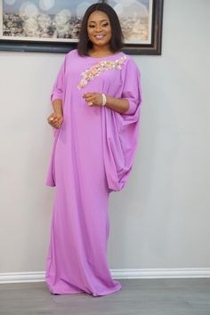 The "Tara Bubu Kaftan Dress - Lilac" is a stunning blend of comfort, elegance, and contemporary design. Featuring a soft lilac hue, this dress is adorned with delicate floral embellishments on the neckline, adding a touch of feminine charm. The loose, flowing silhouette ensures a relaxed fit while maintaining a flattering shape, making it perfect for a variety of occasions, from casual outings to semi-formal events. Whether you're attending a social gathering or simply enjoying a relaxed day, the Tara Bubu Kaftan Dress offers effortless style and sophistication. Its modern design and luxurious feel make it a must-have addition to any wardrobe. Dress Lilac, Lilac Dress, Social Gathering, Kaftan Dress, Dress Clothes For Women, Semi Formal, Formal Event, Effortless Style, Contemporary Design