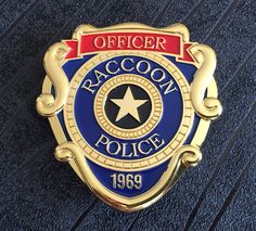 Raccoon City R.P.D. Metal Costume/Cosplay Badge available with Pin fixture (66mm x 63mm) Material: Zinc Alloy Colour: Gold, Blue and Red Fixtures: Pin Dimensions: 66mm x 63mm Weight: 62 grams Please read the shipping options below and select the required option at checkout. ----Shipping Information---- All of our products are shipped from the United Kingdom. All the items we sell are in stock items and will ship same day or next day depending on the time the item was purchased. Please note all d Resident Evil Raccoon City, Metal Props, Red Banner, Umbrella Corporation, Blue Banner, Police Badge, Tactical Vest, Estilo Preppy, Star Logo