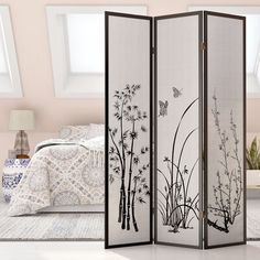 the room divider is decorated with black and white flowers, grass and butterflies on it