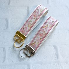 Cherry Blossom Vegan Leather Wristlet Keychain Key chain, Bridesmaid Gift Idea Gifts Under 20 For Her, Wristlet key fob, lanyard fob You are purchasing ONE wristlet keychain as shown in the photos above.  Designed with a combination of vegan leathers, this wristlet features an appliquéd center that can be monogrammed or personalized for an additional fee.   This wristlet is 5x1.25" not counting the hardware.   Due to the nature of the different vinyls, pattern placement will vary.  No two are ex Cute Key Lanyard, Wrist Lanyard Aesthetic, Car Keys Keychain Ideas With Wallet, Car Key Keychain, Wallet With Keychain, Rectangular Keychain With Wrist Strap Gift, Rectangular Keychain With Wrist Strap, Wristlet Keychain Ideas, Cute Car Keys Keychains Ideas