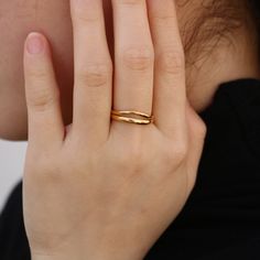 Modern yet timeless, the gold wave ring features a split shank. It is the stylish but simple piece you've been looking for. Wear it alone or stack with other rings to make a statement look. 18k gold plated Stainless steel based Waterproof and tarnish free Available in US size 6-8 Ring sizing chart Gold Stackable Rings With Polished Finish And Modern Twist, Gold Double Band Rings With Modern Twist, Modern Twist Double Band Gold Rings, Gold Double Band Stackable Rings With Modern Twist, Gold Stackable Rings With Modern Twist, Modern Twist Gold Stackable Rings With Open Band, Gold Stackable Rings With Open Band In Modern Style, Gold Stackable Rings With Open Band And Modern Twist, Gold Minimalist Bypass Ring With Polished Finish