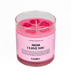 a pink candle with the words i love you written on it