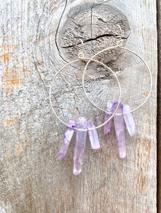 Raw purple quartz crystal points in gold or silver hoop earrings with French hooks. Perfect little boho look. Light weight and easy to wear. Add these to your boho outfits and make a 💜Healing clear quartz Crystal property has been know for centuries to restore balance in the body. -Options- 30mm as shown 21 gauge hoops Total drop Length: 2.3 inches 14k Gold filled hoops Sterling silver hoops Gold plated hoops Silver plated hoops All comes with hooks Simple, Dainty, Delicate, yet so Elegant and Purple Bohemian Everyday Jewelry, Bohemian Wire Wrapped Hoop Jewelry, Bohemian Sterling Silver Hand-wrapped Earrings, Bohemian Sterling Silver Hand Wrapped Earrings, Bohemian Purple Hoop Earrings, Purple Bohemian Hoop Earrings, Bohemian Hand Wrapped Small Hoop Jewelry, Nickel-free Amethyst Bohemian Jewelry, Purple Bohemian Hoop Earrings For Gift