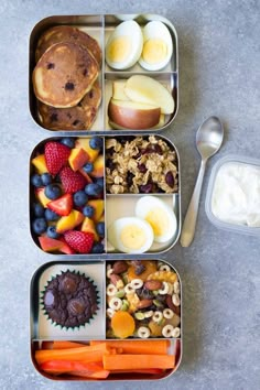 an open lunch box filled with fruit, cereal and muffins