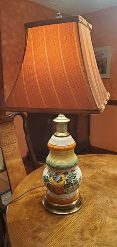 a lamp sitting on top of a wooden table