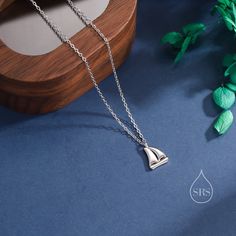 Sailing Boat Pendant Necklace in Sterling Silver, Silver or Gold, Boat Necklace, Sterling SIlver Boat Pendant Dimension:  Chain length: 41cm plus 5cm extension chain.   Production method:  Small Batch Lost-wax casting. Stamp: 925 SRS ( Our brand initials for Silver Rain Silver).  Materials and Care: These are made with solid sterling silver and coated with precious metal Rhodium and with the option of 18ct yellow gold. When not wearing, please keep in a sealed plastic bag.  Packaging: All our je Boat Necklace, Sailing Boat, Wax Casting, Lost Wax Casting, Lost Wax, Bag Packaging, Velvet Bag, Necklace Sterling Silver, Small Batch