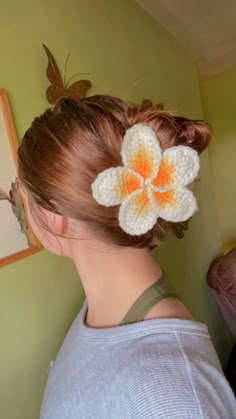 a woman with a flower in her hair