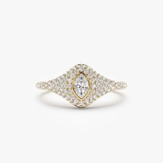 a yellow gold and white diamond ring with an oval shaped center surrounded by small diamonds