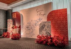 the stage is decorated with red and white flowers