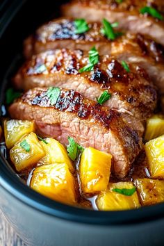 some meat and pineapples in a slow cooker