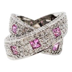 Gorgeous, ultra-feminine pink sapphire and pave diamond crossover band ring. This pretty, contemporary style ring glitters from all directions with sparkling pave set diamonds, while the playful pink sapphires add a pop of color and interest. You will absolutely love how this ring just shines on your finger! This stunning 14 karat white gold band ring features 198 natural white pave diamonds, G-H in color, SI1-SI2 in clarity and totals 2.88 carats. The pave diamonds are embellished throughout th Diamond Crossover Ring, Diamond And Sapphire Ring, Crossover Diamond Ring, Rings Sapphire, Crossover Ring, Diamond Pendant Sets, Pendant Sets, Gold For Sale, White Gold Set