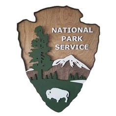 the national park service sign is shown with an image of a bear and trees on it