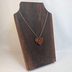 "This heart necklace is carved out of solid wood. Lightweight and ideal for daily wearing. 18\" stainless steel chain included. Wood measures approximately 1.4\" tall x 1.5\" wide. Available in a similar style in earrings: https://www.etsy.com/listing/703026553/wood-earrings-wooden-jewelry-lightweight The item ordered comes in a cute gift bag. Free shipping for US customers! Made and shipped from the United States. Interested in wholesale? No problem! Send me a message and I will be happy to wor Personalized Brown Necklace For Gift, Etched Heart Pendant Necklace For Valentine's Day, Engraved Brown Necklace For Gift, Etched Heart Pendant Necklace For Gift, Heart-shaped Brown Necklace For Gift, Brown Heart Charm Necklace As A Gift, Brown Necklace With Heart Charm For Gift, Brown Heart Charm Necklace As Gift, Brown Heart Charm Necklace For Gift