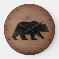 a wooden clock with a bear on it