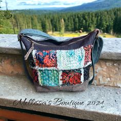 Introducing The Adeline, a handmade, one-of-a-kind convertible-style boho handbag that radiates charm and individuality. This exquisite bag features raggy style quilted patches on the front with upcycled denim for the backside with a zippered pocket and a slip pocket for convenience! Distressed grey cowhide leather accents, beautifully showcasing shades of blue & coral. The Adeline includes strapping that effortlessly converts from shoulder carry to backpack carry in seconds! Designed for comfortable and versatile wear. The leather bottom adds durability, while the gorgeous blue batik cotton interior fabric, enhances its bohemian flair. Inside, you'll find three slip pockets and one zippered pocket, providing ample space for your essentials. Measuring 14" x 11" x 5.5", this handbag offers Bohemian Canvas Satchel Bag, Bohemian Upcycled Tote Shoulder Bag, Bohemian Canvas Bags With Adjustable Strap, Handmade Hippie Hobo Bag For Travel, Hippie Handmade Hobo Bag For Travel, Bohemian Canvas Hobo Bag For Daily Use, Bohemian Canvas Shoulder Bag For Daily Use, Canvas Bohemian Hobo Bag For Daily Use, Bohemian Style Canvas Shoulder Bag For Daily Use