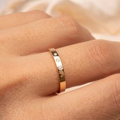 Fall in love with our 14k Flat Diamond Band .04CTW Classy and timeless. The perfect gift for that special someone, or simply as a reminder to love yourself. Featuring 3 Genuine ethically sourced 1.5mm diamonds Band thickness: 2.5mm Material: 14k Gold and Genuine Diamonds 14k Yellow Gold Bands As Gift, Fine Jewelry Brilliant Cut Couple Rings As Gift, Fine Jewelry Couple Rings With Brilliant Cut As Gift, Diamond Stackable Engraved Ring For Anniversary, Stackable Diamond Engraved Ring For Anniversary, Yellow Gold Promise Rings With Hallmarks, Dainty 14k Gold Band For Gift, Stackable Engraved Diamond Ring For Anniversary, Dainty 14k Gold Band As Gift