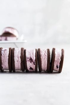 an ice cream sandwich is lined up on a plate and ready to be cut in half