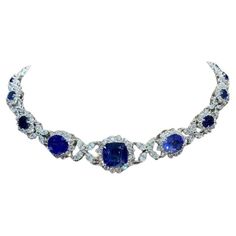 Behold the allure of this exquisite blue Ceylon Sapphires and Diamonds necklace. Each perfectly matched blue Sapphires exudes a captivating hue , complemented by sparkly diamonds , that elevate the design to a level of unrivaled elegance and feminine charm. The masterpiece is a timeless embodiment of grace and sophistication , destined to captivate all who behold it. The design is contemporary yet classic, making it perfect for any formal or casual occasion. It is a lovely piece of jewelry that would make an exquisite addition to any collection. Magnificent necklace come in 18k gold with 13 pieces of Natural Ceylon Sapphires of 33,00 carats, high quality, spectacular blue color, and Natural Diamonds in special cut , of 14,00 carats, F color VS clarity, very sparkly. Handcrafted by artisan Luxury Blue Jeweled Necklaces, Luxury Sapphire Necklace, Exquisite Sapphire Necklace, Luxury Exquisite Sapphire Necklace, Luxury Blue Diamond-cut Necklace, Ceylon Blue Sapphire, Diamonds Necklace, Ceylon Sapphire, Necklace Diamond