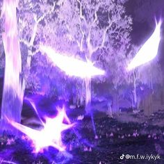 two white birds flying in the air near trees and bushes at night time with purple light