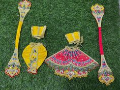 an assortment of decorative items laying on the grass