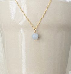 This is a classic and dainty aquamarine pendant necklace on an 18k gold finish chain over 925 sterling silver. Aquamarine represents happiness, hope and everlasting youth. Each order comes in a gift box and jewelry pouch, making it the perfect gift. *Please note, natural gemstones have slight variations so each piece will be unique and may vary slightly from what is pictured. This is handmade with love in my Gilbert, Arizona studio. Necklace Details: Finish: 18K Gold Material: Solid 925 Sterling Silver Chain Length: 17 inches + 2 inch extender Closure: Lobster clasp Gemstone: Aquamarine  Gemstone Size: 0.31 inches Pendant Dangle Length: 0.50 inches  Hypoallergenic  💎Care Instructions💎 - Do not Sleep, Sweat, Swim, Spray & Shower in your jewelry - Clean items with a soft cloth. - Do not us Gold Aquamarine Birthstone Necklace, Dainty Aquamarine Gold Jewelry, Gold Aquamarine Pendant Necklace, March Birthstone Necklace, Pouch Making, Gilbert Arizona, 18k Gold Necklace, Aquamarine Pendant, Aquamarine Necklace