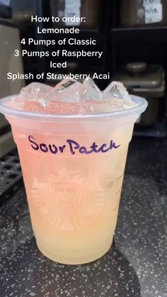 a plastic cup filled with liquid on top of a table