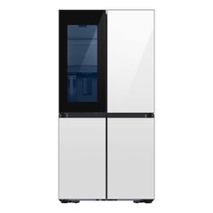 a white and black refrigerator freezer sitting next to each other