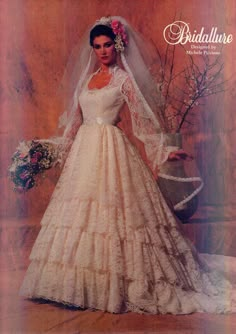 a woman in a wedding dress and veil posing for a magazine cover with flowers on her head